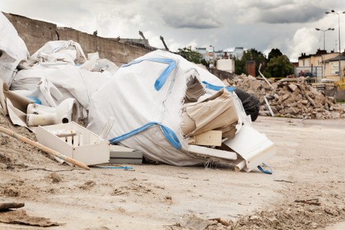 Charity volunteers collecting reusable furniture from a commercial site
