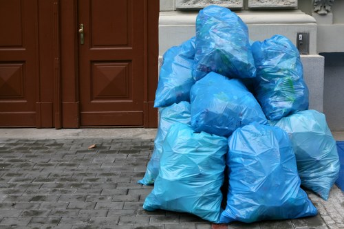 Commercial waste collection vehicle in Surbiton with environmental focus